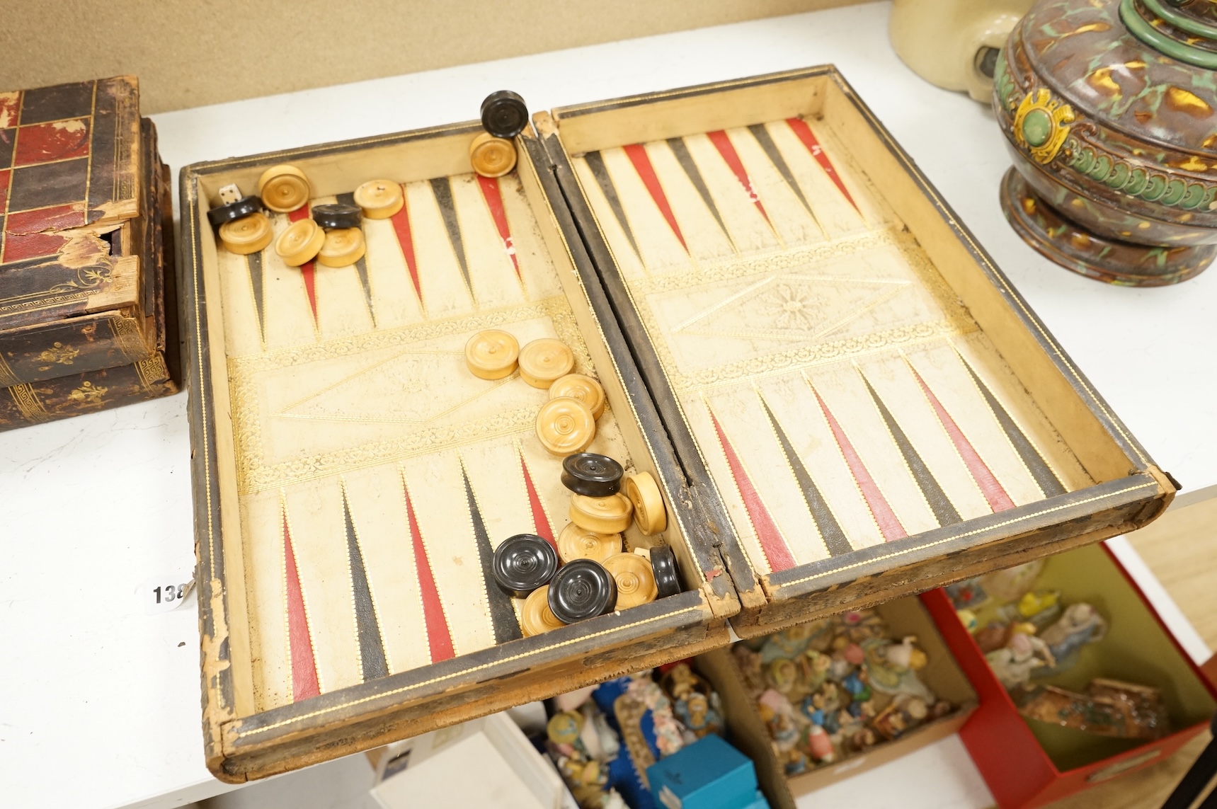 Three folding chess and backgammon boards in the form of books, 42cm